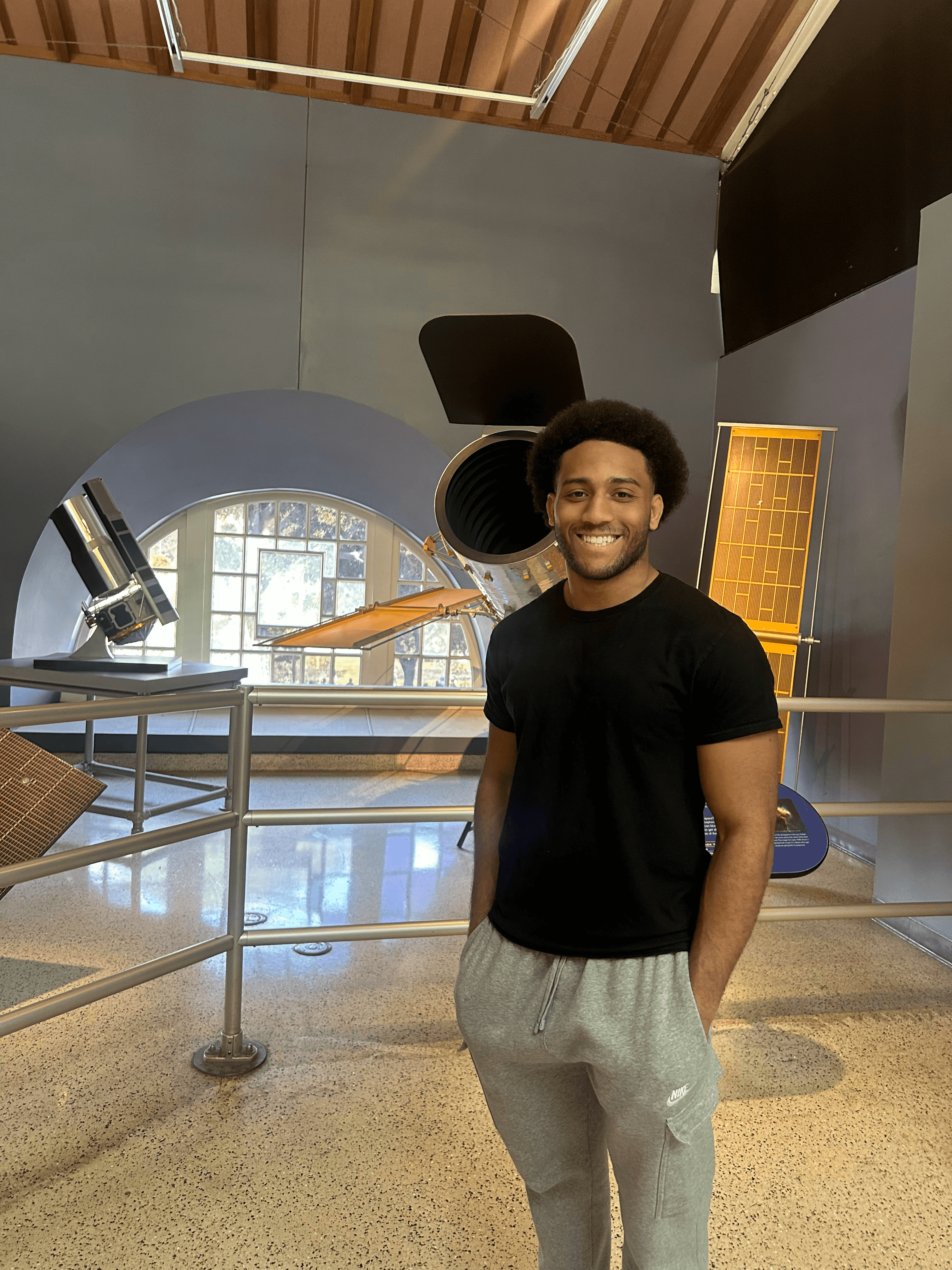 Pearson Hill, founder of HillWebWorks, smiling in a bright indoor setting — reach out to connect directly.